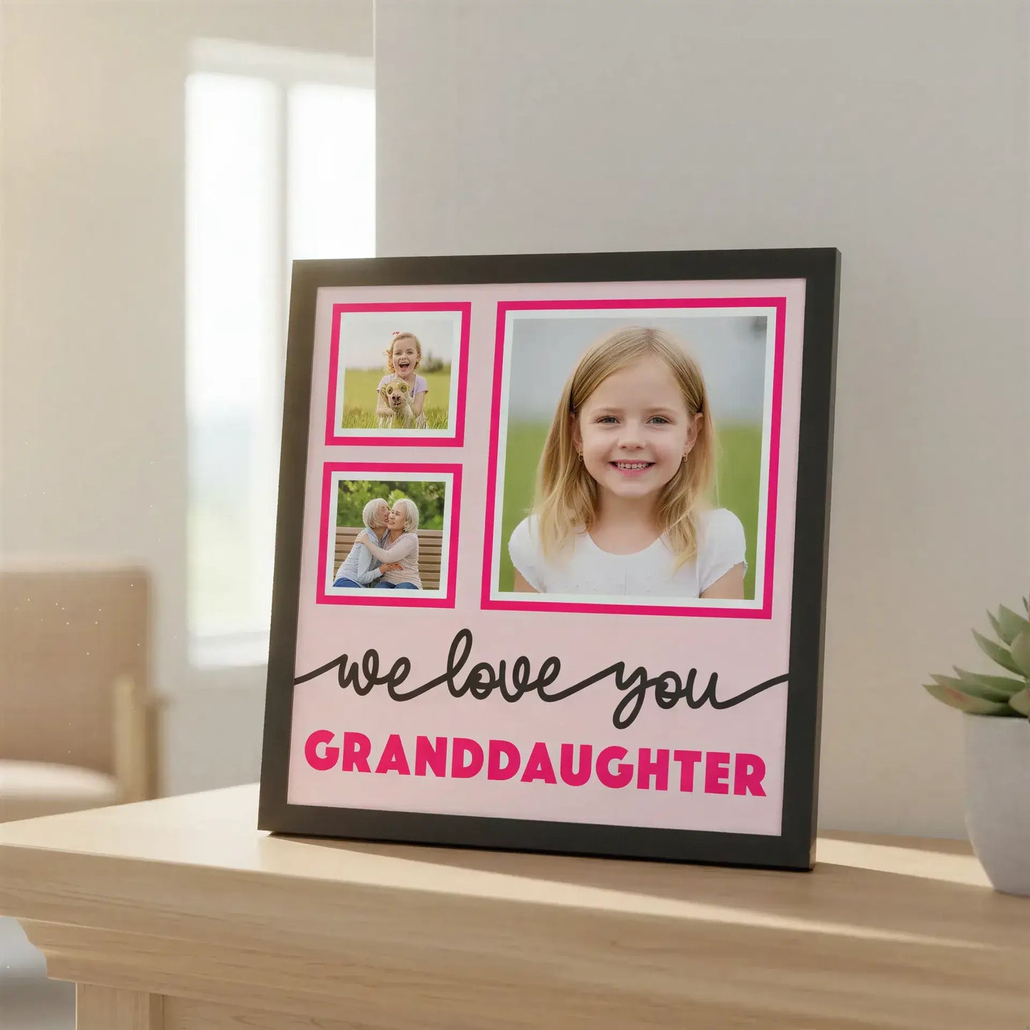 Decorative wall art with pink and black text and frames on a light pink background