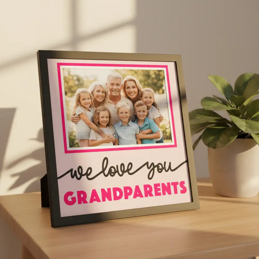 Decorative card with 'we love you GRANDPARENTS' text on a pink background