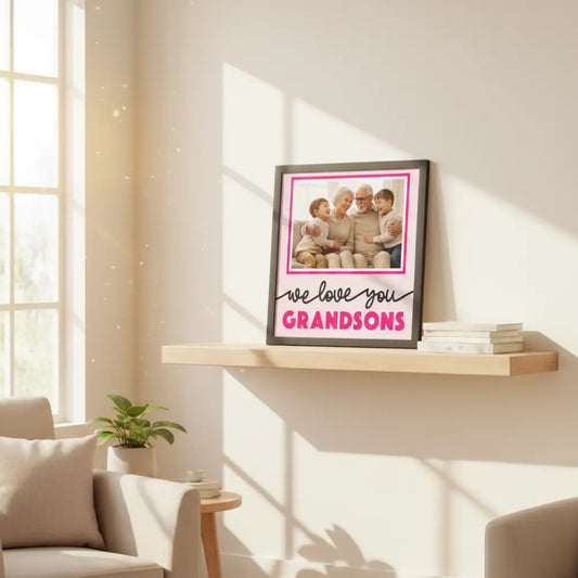 Decorative photo frame with 'we love you GRANDSONS' text on a pink background