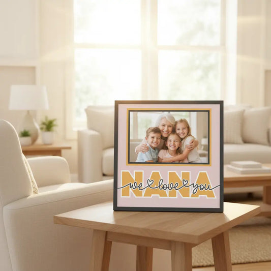 Decorative sign with 'Nana, we love you' text on a pink background