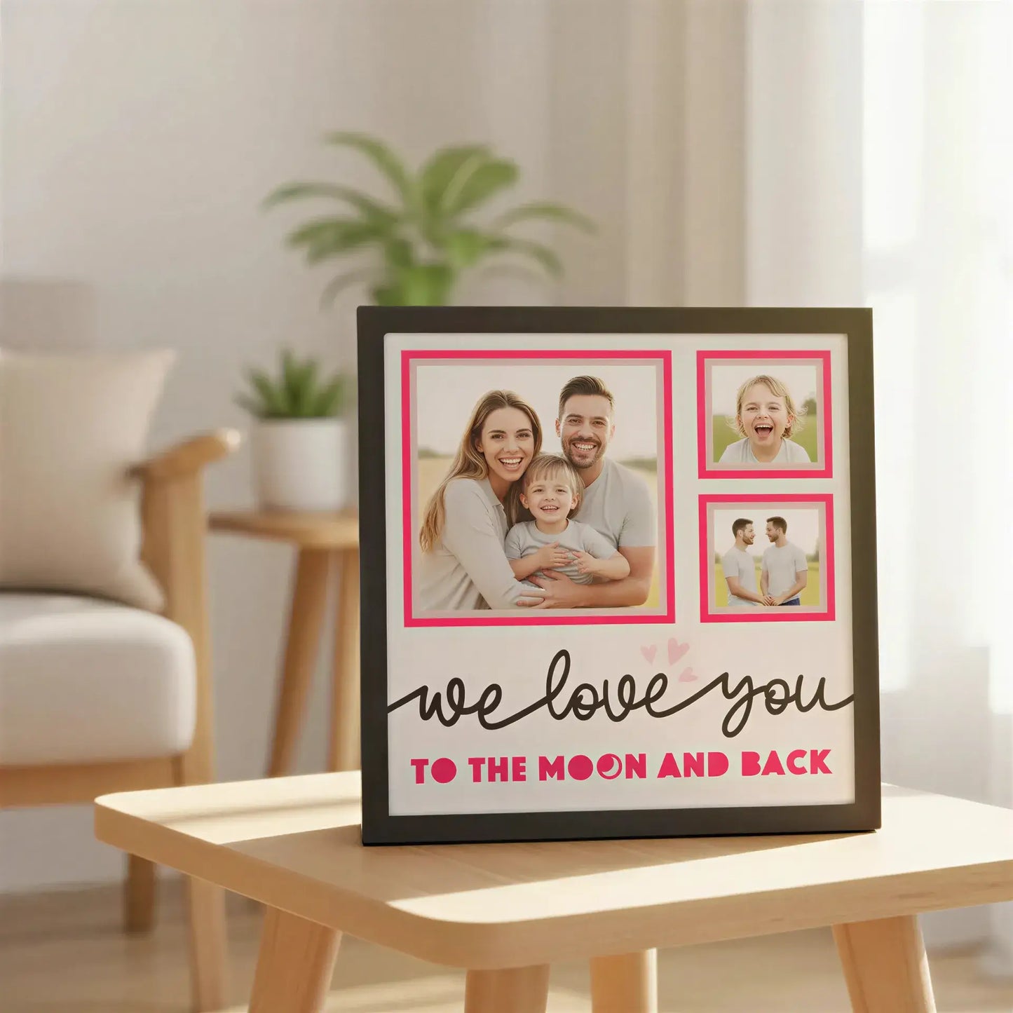 Decorative wall art with pink frames and 'we love you to the moon and back' text.